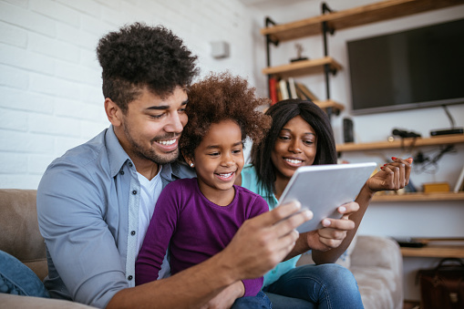 Family looking at an iPad together